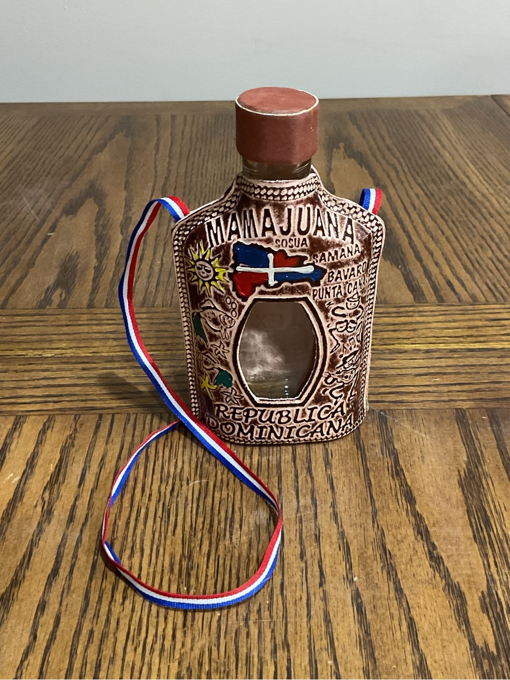 Mamajuana Decorative Bottle and carry strap with Dominican Flag Colors